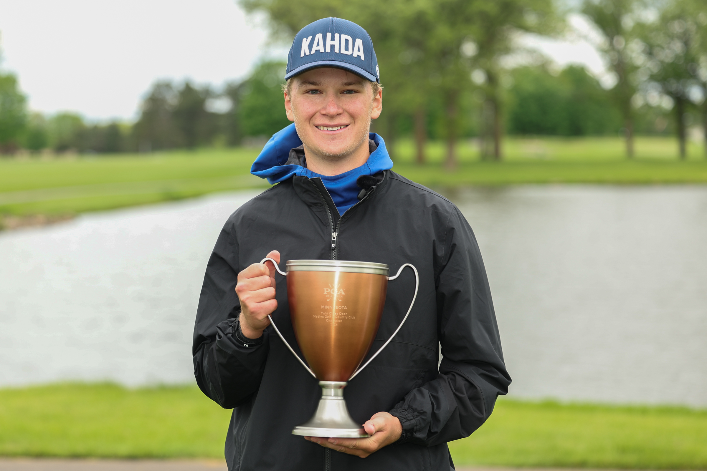 Ian Friederichs with the Twin Cities Open trophy at Medina Golf and Country Club.